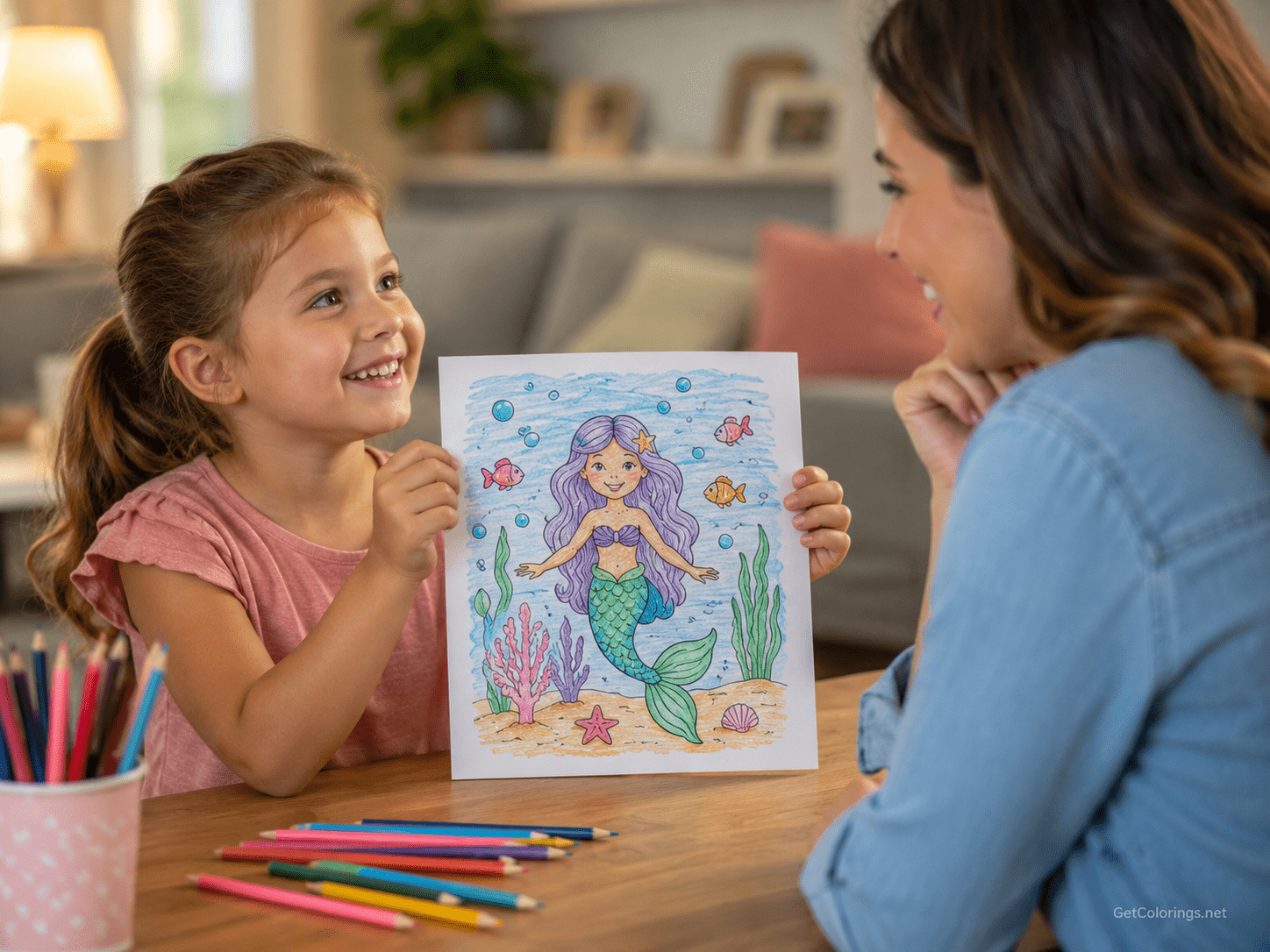 Child proudly showing a completed mermaid coloring page to a parent